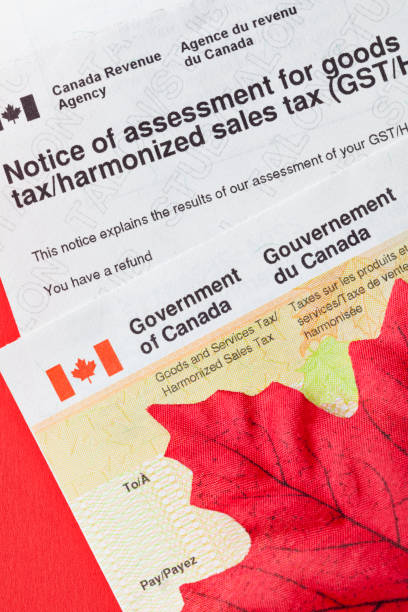 istock Government of Canada Tax Assessment Form and Refund Check with Maple Leaf 1486136855