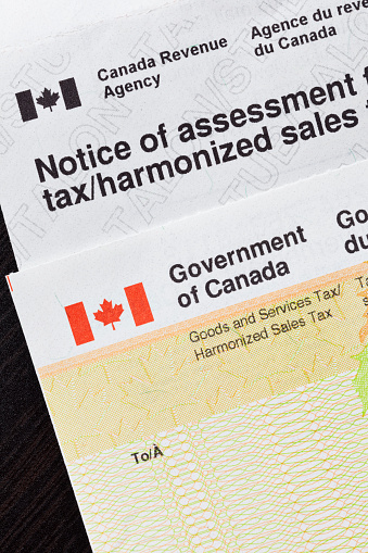 Close up of a Government of Canada tax assessment form and refund check.