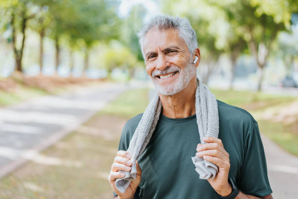 istock Senior man runner holding towel around neck 1486144175