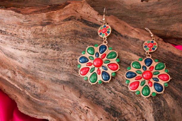 beautiful stone earrings on wooden background