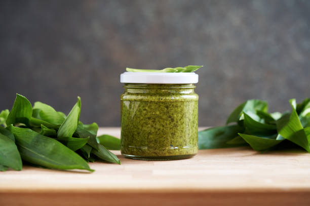 istock Canned wild garlic pesto with fresh leaves 1486147694