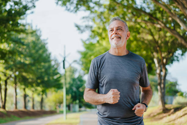 istock Portrait of a senior man running in the public park 1486147708