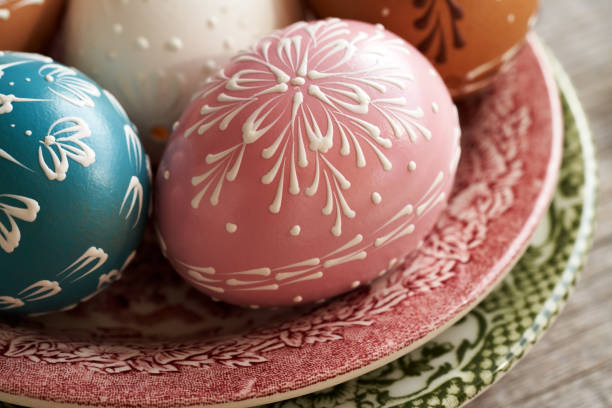 Easter egg decorated with ribbon. Shallow depth of field with focus on ribbon bow.