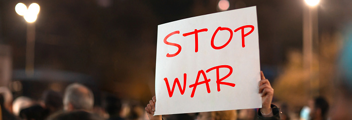 People In The Street with Stop War text.
