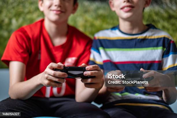 Boys Playing Playstation Stock Photo - Download Image Now - Leisure Activity, Two People, Gamer