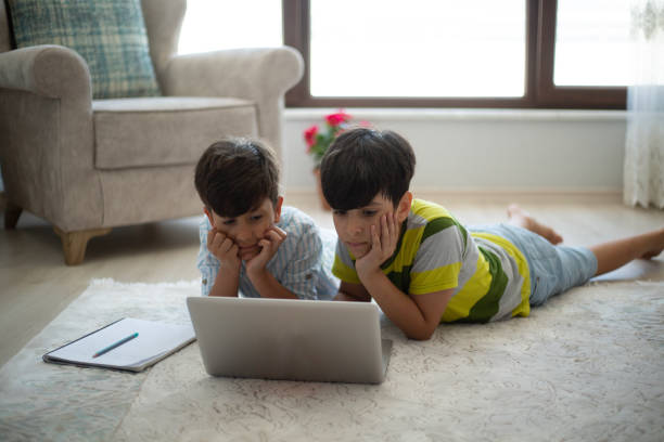 istock Little boys doing homework at home 1486157659