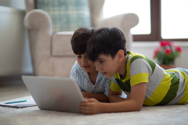 istock Little boys doing homework at home 1486157677
