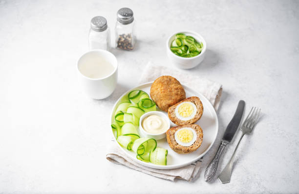 istock Scotch eggs with mustard suace and cucumbers 1486157798