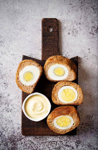 istock Scotch eggs with mustard suace and cucumbers 1486157812