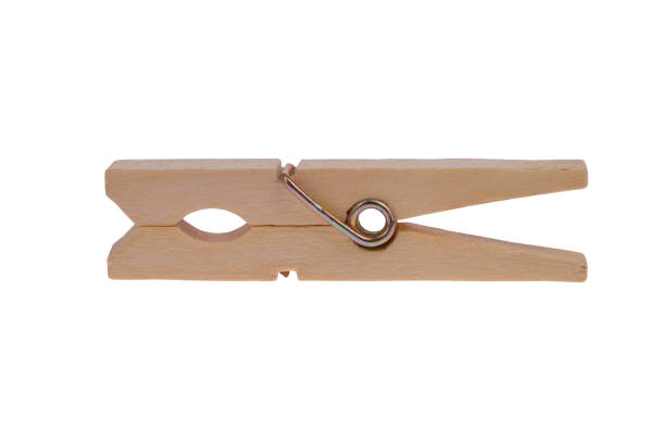 istock Wooden clothes pins. Concept isolated on white background 1486158359