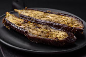 Delicious eggplant cut into two halves baked with salt, spices and herbs