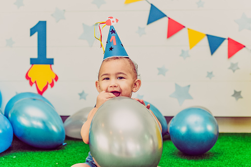 Birthday. First year. Party. Balloon. Hat. Family