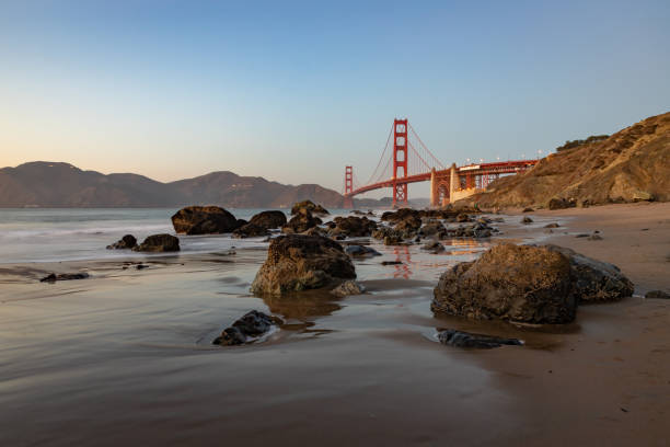 istock Golden Gate Bridge and Baker Beach Rocks at Sunset 1486166694