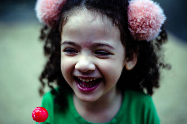 A laughing child at the window.