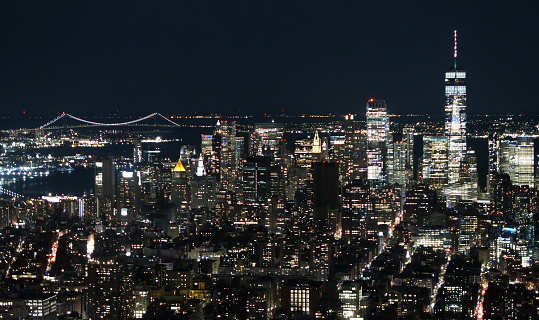 The bright lights of New York at night, as seen from an arial perspective.