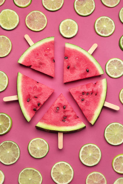 istock Tasty sliced watermelon and limes on red background, flat lay 1486168809
