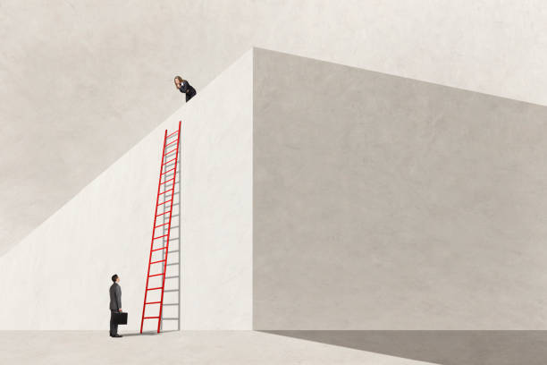 istock Woman Wondering Why Man Isn't Climbing Ladder 1486169285