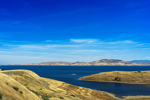 Wide view of San Luis Reservoir, which is part of the California Aqueduct system.

Taken in the Central Coast of California.