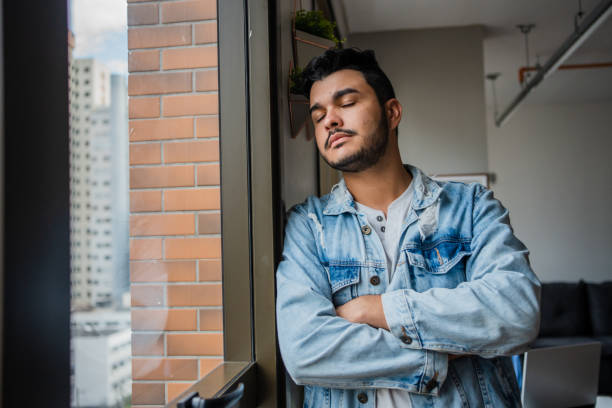 istock Pensive man at home 1486171261