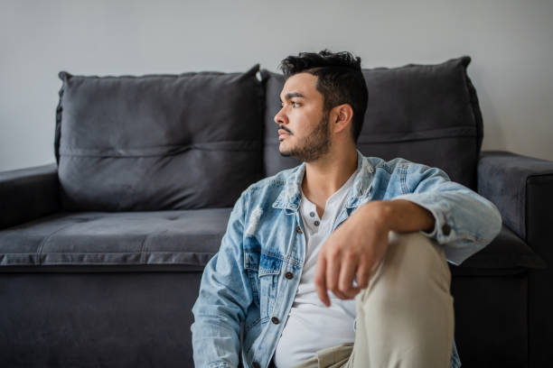 istock Pensive man at home 1486171268