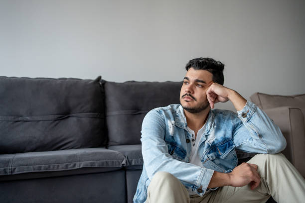istock Pensive man at home 1486171269