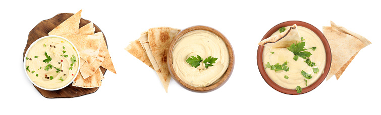 Set with delicious hummus with pita chips on white background, top view, Banner design