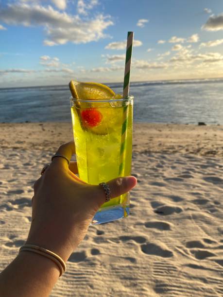 istock Cocktail at sunset on the beach 1486172280