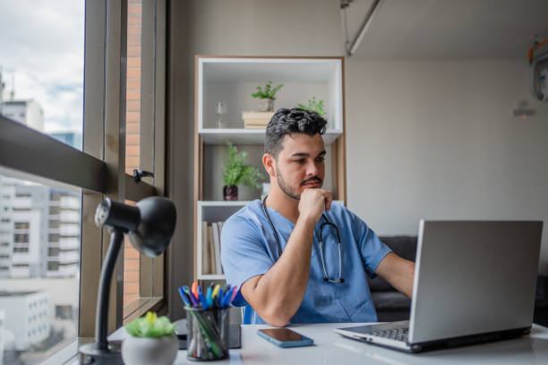Thoughtful male nurse in his office
