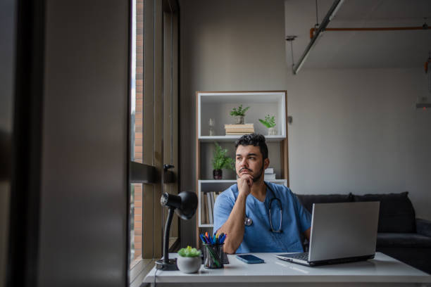 istock Thoughtful male nurse in his office 1486172859