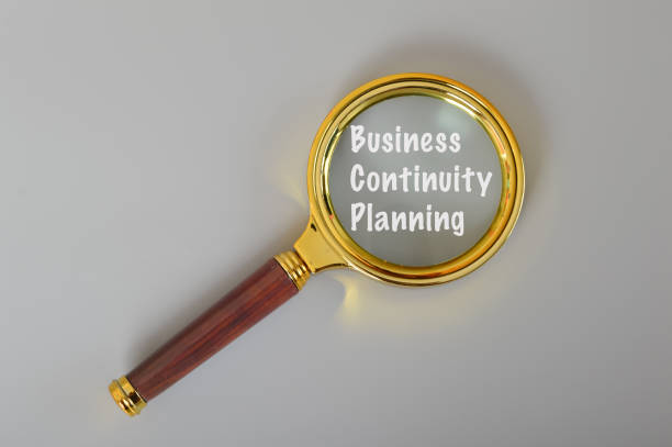 istock Magnifying glass written with BUSINESS CONTINUITY PLANNING. 1486173726