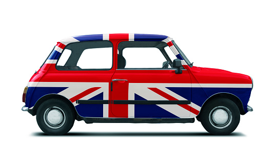 Classic British car from the 60s and 70s, with the English flag painted on the body. Union jack