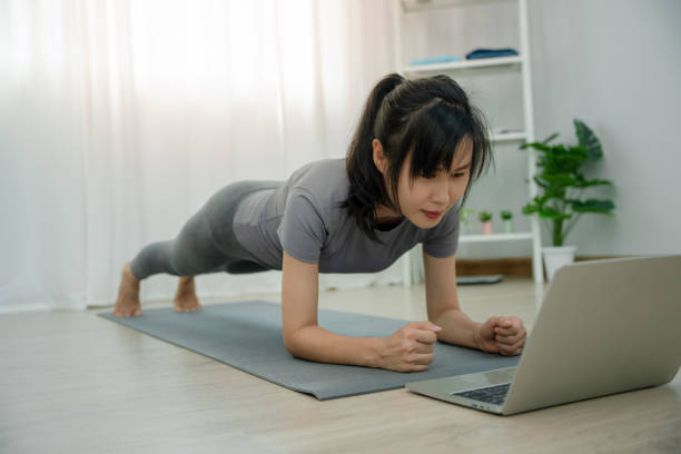 istock Asian women doing planking exercises to build abdominal muscles. Exercise regularly for a healthy body. 1486173853
