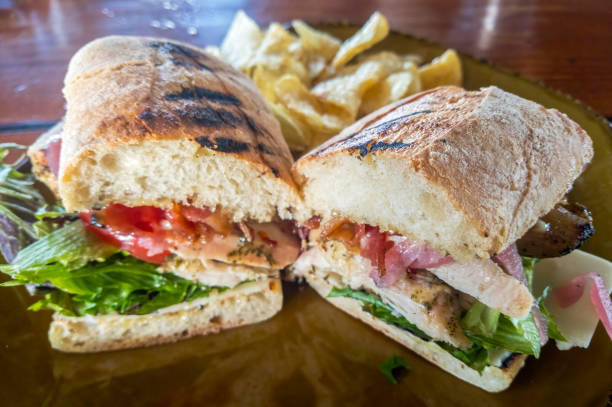 istock Turkey Club Sandwich with Chips 1486177095