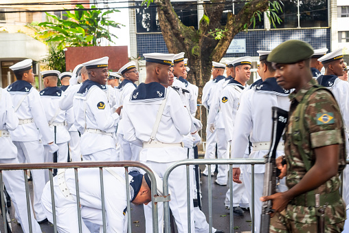 troops or soldiers marching in line