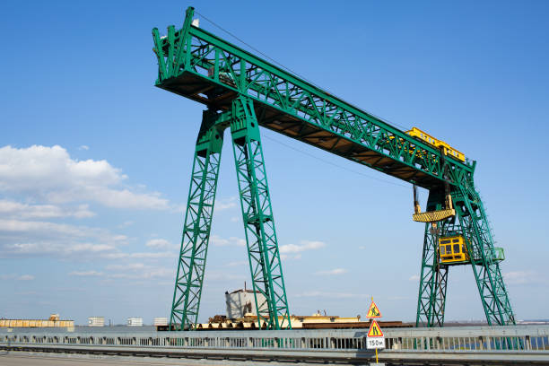 istock Green gantry crane near the road bridge. 1486190851