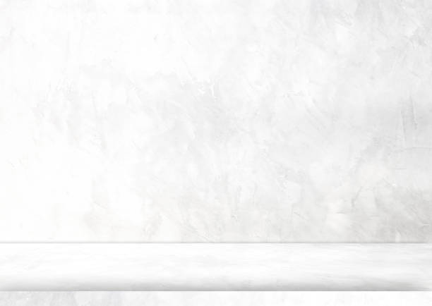 istock background and concrete backdrop and cement shelf showing products in black and gray , empty studio interior and with empty messages background. 1486200143