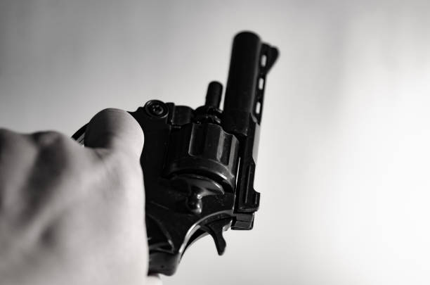 istock Gun in hand  monotone in crime concept. 1486200200