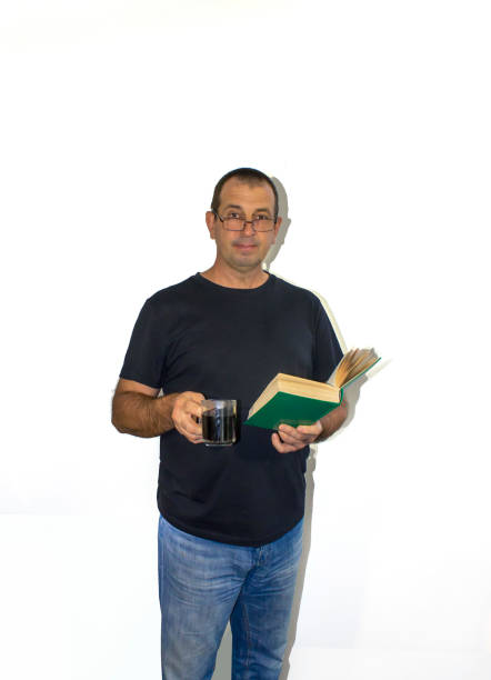 istock adult man with book and coffee, teacher 1486201720