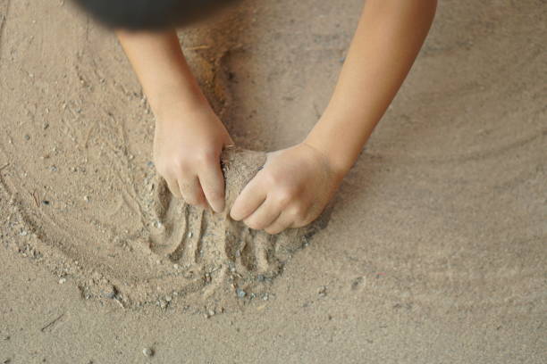 istock Boy playing with soil in the home area 1486203820