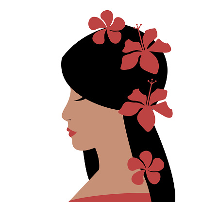 Profile of Pacific Islander woman with tropical flowers in the hair