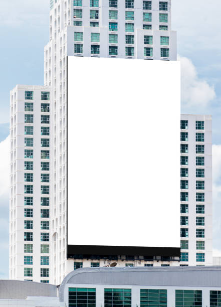 istock Mock up white large LED display vertical billboard on tower building .clipping path for mockup 1486206414