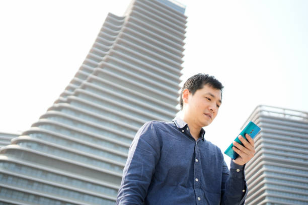 istock The businessman is checking his schedule on his mobile phone 1486208238
