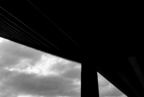 silhouette of black and white bridge in the sky