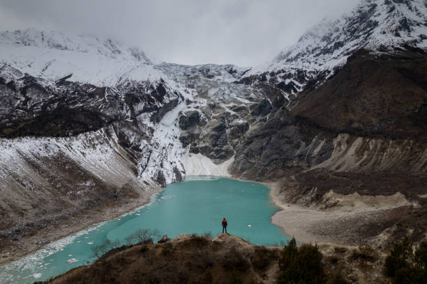 The picturesque turquoise mountain lake is a sight to behold, with the dazzling color of the water and stunning scenery capturing the essence of nature's beauty