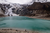 Nestled high in the mountains, the shimmering turquoise lake