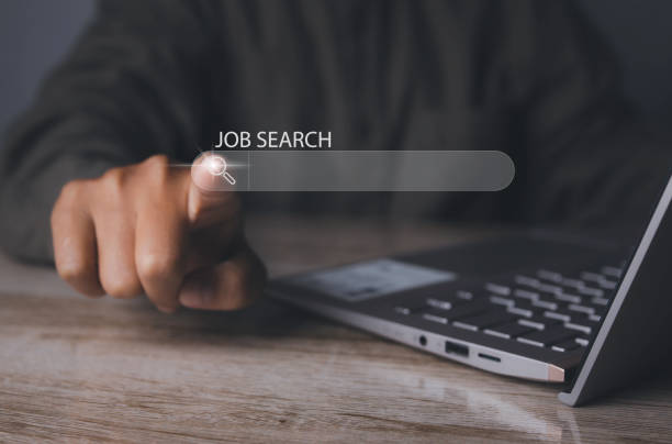 istock Man browsing work opportunities online by laptop computer. Job search. 1486218112
