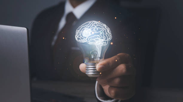 istock Businessman holding light bulbs with brainstorming creative idea and innovation. 1486218123