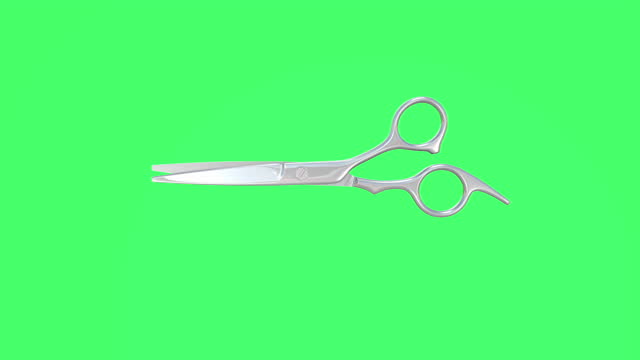 Scissors animated on a green screen background