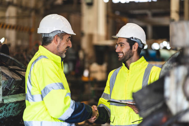 istock professional technician engineer with safety hard hat working to maintenance construction equipment in industrial factory, inspection man having manufacturing occupation job of production technology 1486226566