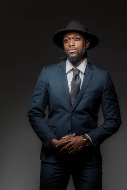 istock Handsome elegant black male posing for studio portrait wearing a hat 1486226585